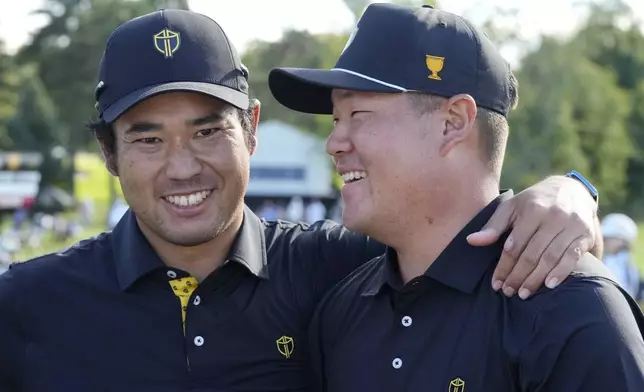 International team member Hideki Matsuyama, left, of Japan, and partner Sungjae Im, right, of South Korea, celebrate after winning a second-round foursome match at the Presidents Cup golf tournament at Royal Montreal Golf Club, Friday, Sept. 27, 2024 in Montreal. (Frank Gunn/The Canadian Press via AP)