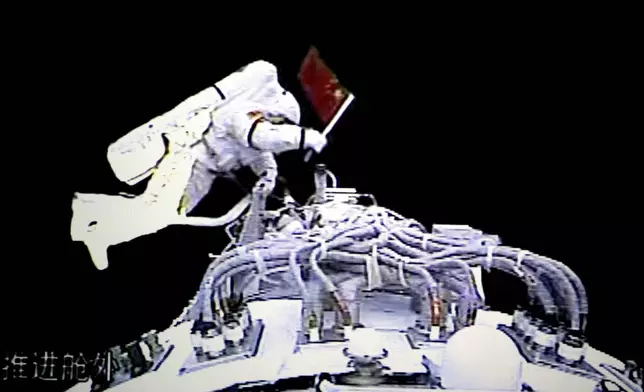 FILE - In this image from video provided by the Beijing Space Command and Control Center and the Xinhua News Agency on Sept. 27, 2008, Chinese astronaut Zhai Zhigang walks outside the orbit module of the Shenzhou-7 spacecraft for a spacewalk after docking with the Chinese station Tiangong 1. (Beijing Space Command and Control Center, Xinhua via AP, File)