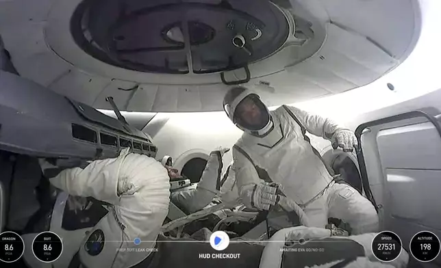 This image made from a SpaceX video shows the crew of the first private spacewalk led by tech billionaire Jared Isaacman inside the capsule, Thursday Sept. 12, 2024. (SpaceX via AP)