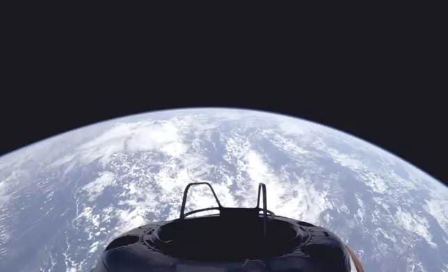 This image provided by SpaceX on Tuesday, Sept. 10, 2024, shows a view of Earth and the Dragon capsule's Skywalker spacewalk platform shortly after the Polaris Dawn crew launched into an orbit. (SpaceX via AP)