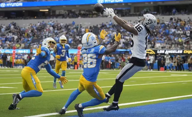 Las Vegas Raiders wide receiver Jakobi Meyers (16) cannot catch a pass in the end zone against Los Angeles Chargers cornerback Asante Samuel Jr. (26) during the second half of an NFL football game, Sunday, Sept. 8, 2024, in Inglewood, Calif. (AP Photo/Marcio Jose Sanchez)