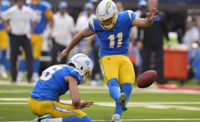 Los Angeles Chargers place kicker Cameron Dicker (11) kicks a field goal from the hold of JK Scott during the second half of an NFL football game against the Las Vegas Raiders, Sunday, Sept. 8, 2024, in Inglewood, Calif. (AP Photo/Marcio Jose Sanchez)