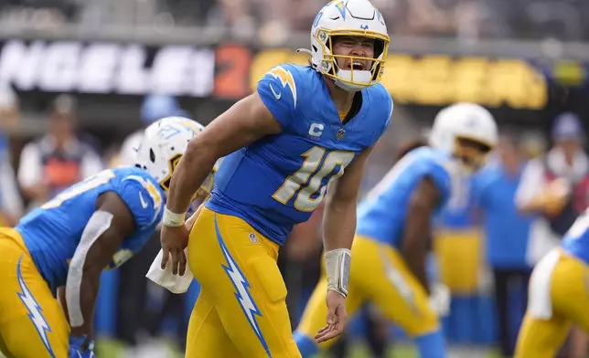 Los Angeles Chargers quarterback Justin Herbert calls a play during the second half of an NFL football game against the Las Vegas Raiders, Sunday, Sept. 8, 2024, in Inglewood, Calif. (AP Photo/Marcio Jose Sanchez)