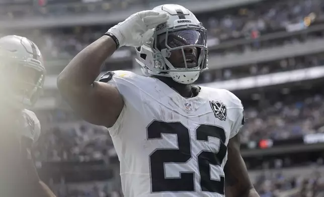 Las Vegas Raiders running back Alexander Mattison celebrates after running for a touchdown against the Los Angeles Chargers during the first half of an NFL football game, Sunday, Sept. 8, 2024, in Inglewood, Calif. (AP Photo/Marcio Jose Sanchez)