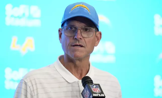 Los Angeles Chargers head coach Jim Harbaugh speaks at a news conference after an NFL football game against the Las Vegas Raiders, Sunday, Sept. 8, 2024, in Inglewood, Calif. (AP Photo/Ashley Landis)