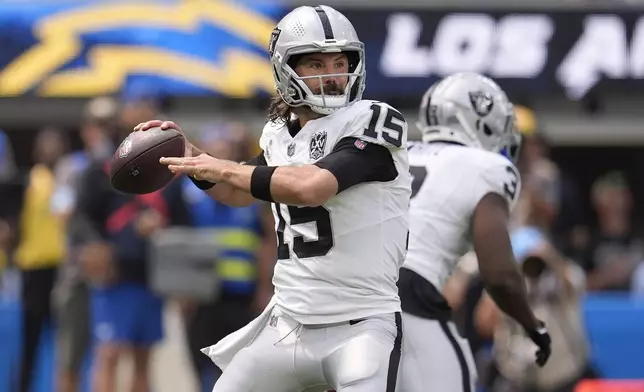 Las Vegas Raiders quarterback Gardner Minshew II (15) passes against the Los Angeles Chargers during the first half of an NFL football game, Sunday, Sept. 8, 2024, in Inglewood, Calif. (AP Photo/Marcio Jose Sanchez)