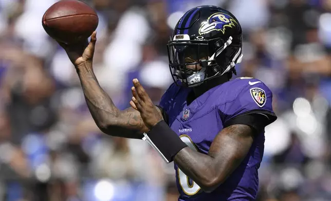 Baltimore Ravens quarterback Lamar Jackson (8) throws against the Las Vegas Raiders during the first half of an NFL football game, Sunday, Sept. 15, 2024, in Baltimore. (AP Photo/Nick Wass)