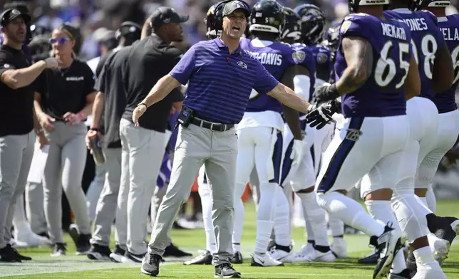 Baltimore Ravens head coach John Harbaugh celebrates after the Baltimore Ravens kicked a field goal against the Las Vegas Raiders during the first half of an NFL football game, Sunday, Sept. 15, 2024, in Baltimore. (AP Photo/Nick Wass)