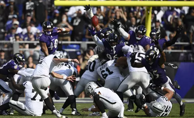 Las Vegas Raiders place kicker Daniel Carlson (2) kicks a field goal against the Baltimore Ravens during the second half of an NFL football game, Sunday, Sept. 15, 2024, in Baltimore. (AP Photo/Nick Wass)