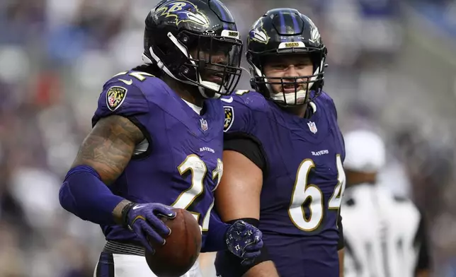 Baltimore Ravens running back Derrick Henry (22) celebrates after scoring a touchdown against the Las Vegas Raiders during the second half of an NFL football game, Sunday, Sept. 15, 2024, in Baltimore. (AP Photo/Nick Wass)