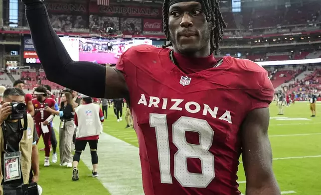 Arizona Cardinals wide receiver Marvin Harrison Jr., leaves the field after an NFL football game against the Los Angeles Rams, Sunday, Sept. 15, 2024, in Glendale, Ariz. The Arizona Cardinals won 41-10. (AP Photo/Ross D. Franklin)
