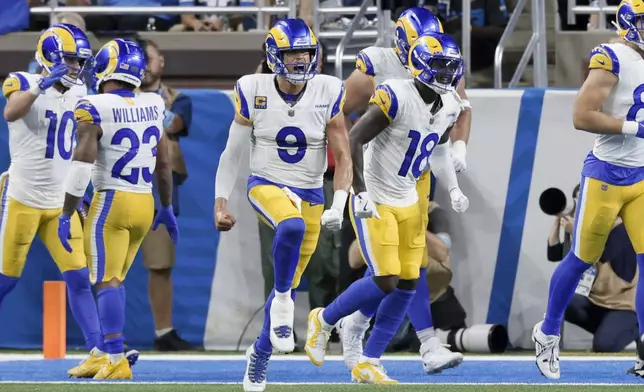 Los Angeles Rams quarterback Matthew Stafford (9) celebrates a touchdown against the Detroit Lions in the second half of an NFL football game in Detroit, Sunday, Sept. 8, 2024. (AP Photo/Duane Burleson)