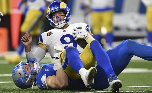 Detroit Lions defensive end Aidan Hutchinson (97) sacks Los Angeles Rams quarterback Matthew Stafford (9) in the second half of an NFL football game in Detroit, Sunday, Sept. 8, 2024. (AP Photo/David Dermer)