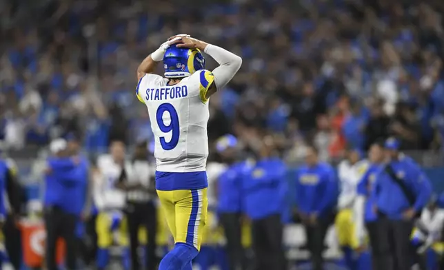 Los Angeles Rams quarterback Matthew Stafford (9) walks to the bench against the Detroit Lions during the second half of an NFL football game in Detroit, Sunday, Sept. 8, 2024. (AP Photo/David Dermer)