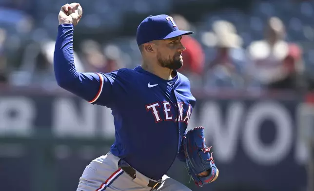 Texas Rangers' Nathan Eovaldi pitches during the first inning of a baseball game against the Los Angeles Angels, Sunday, Sept. 29, 2024, in Anaheim, Calif. (AP Photo/John McCoy)