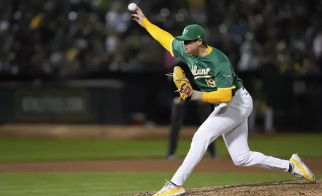 Oakland Athletics pitcher Mason Miller throws to a Texas Rangers batter during the ninth inning of a baseball game Tuesday, Sept. 24, 2024, in Oakland, Calif. (AP Photo/Godofredo A. Vásquez)