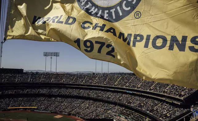 Fans are seen at Oakland Coliseum during a baseball game between the Oakland Athletics and the Texas Rangers in Oakland, Calif., Thursday, Sept. 26, 2024. (Stephen Lam/San Francisco Chronicle via AP)