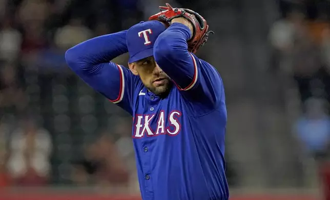 Texas Rangers pitcher Nathan Eovaldi throws against the Arizona Diamondbacks during the first inning of a baseball game, Tuesday, Sept. 10, 2024, in Phoenix. (AP Photo/Darryl Webb)