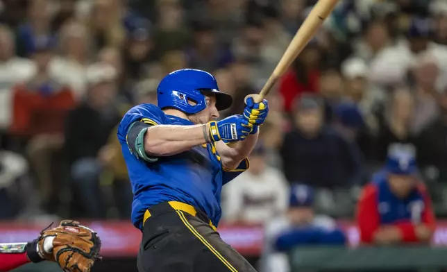 Seattle Mariners' Luke Raley hits a two-run home run during the fifth inning of a baseball game against the Texas Rangers, Saturday, Sept. 14, 2024, in Seattle. (AP Photo/Stephen Brashear)