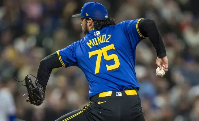 Seattle Mariners reliever Andres Munoz delivers a pitch during the ninth inning of a baseball game against the Texas Rangers, Saturday, Sept. 14, 2024, in Seattle. (AP Photo/Stephen Brashear)