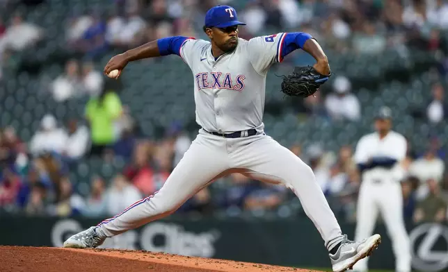 Texas Rangers starting pitcher Kumar Rocker throws against the Seattle Mariners during the second inning of a baseball game in his major league debut, Thursday, Sept. 12, 2024, in Seattle. (AP Photo/Lindsey Wasson)