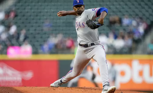 Texas Rangers starting pitcher Kumar Rocker throws against the Seattle Mariners in his major league debut during the first inning of a baseball game Thursday, Sept. 12, 2024, in Seattle. (AP Photo/Lindsey Wasson)