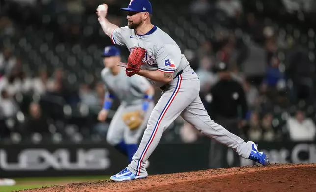 Texas Rangers relief pitcher Kirby Yates throws against the Seattle Mariners during the ninth inning of a baseball game Thursday, Sept. 12, 2024, in Seattle. (AP Photo/Lindsey Wasson)