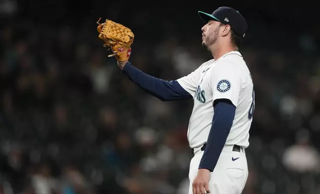 Seattle Mariners relief pitcher Tayler Saucedo reacts to giving the Texas Rangers the lead on an RBI single by Texas Rangers' Nathaniel Lowe during the eighth inning of a baseball game Thursday, Sept. 12, 2024, in Seattle. (AP Photo/Lindsey Wasson)