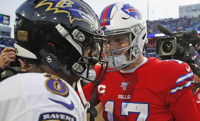 FILE - Buffalo Bills quarterback Josh Allen (17) talks with Baltimore Ravens quarterback Lamar Jackson (8) following a 24-17 Ravens win in an NFL football game in Orchard Park, N.Y., in this Sunday, Dec. 8, 2019, file photo. (AP Photo/John Munson, File)