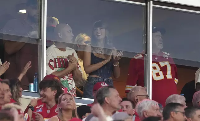 Taylor Swift is seen in a suite before the start of an NFL football game between the Kansas City Chiefs and the Baltimore Ravens Thursday, Sept. 5, 2024, in Kansas City, Mo. (AP Photo/Ed Zurga)