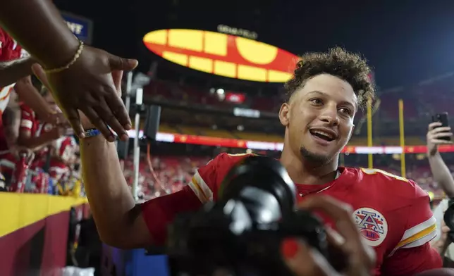 Kansas City Chiefs quarterback Patrick Mahomes celebrates as he heads off the field following an NFL football game against the Baltimore Ravens Thursday, Sept. 5, 2024, in Kansas City, Mo. The Chiefs won 27-20. (AP Photo/Ed Zurga)