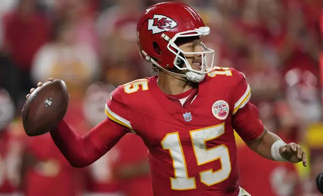 Kansas City Chiefs quarterback Patrick Mahomes (15) throws during the second half of an NFL football game against the Baltimore Ravens Thursday, Sept. 5, 2024, in Kansas City, Mo. (AP Photo/Charlie Riedel)