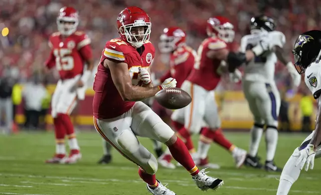 Kansas City Chiefs tight end Travis Kelce is unable to catch a pass during the first half of an NFL football game against the Baltimore Ravens Thursday, Sept. 5, 2024, in Kansas City, Mo. (AP Photo/Ed Zurga)