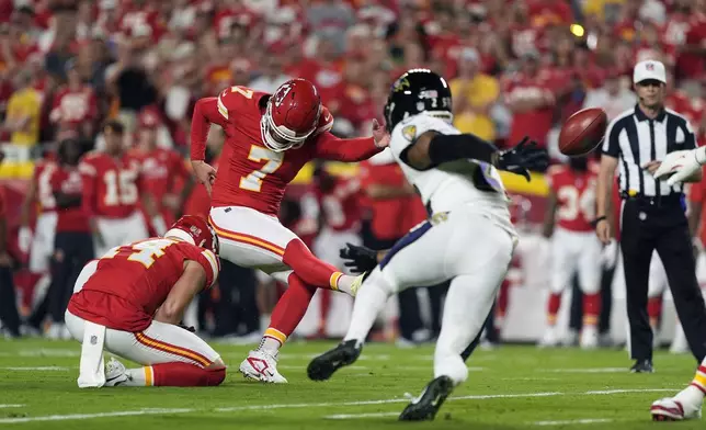 Kansas City Chiefs kicker Harrison Butker (7) makes a 32-yard field goal during the first half of an NFL football game against the Baltimore Ravens Thursday, Sept. 5, 2024, in Kansas City, Mo. (AP Photo/Charlie Riedel)