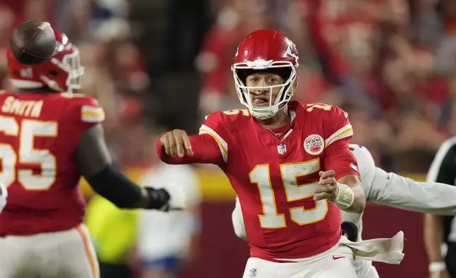 Kansas City Chiefs quarterback Patrick Mahomes throws during the second half of an NFL football game against the Baltimore Ravens Thursday, Sept. 5, 2024, in Kansas City, Mo. (AP Photo/Charlie Riedel)