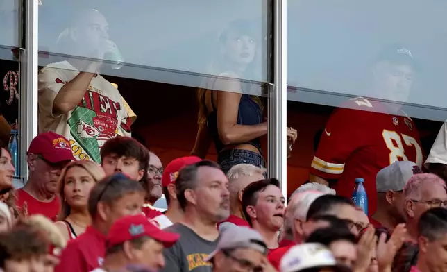 Taylor Swift is seen in a suite before the start of an NFL football game between the Kansas City Chiefs and the Baltimore Ravens Thursday, Sept. 5, 2024, in Kansas City, Mo. (AP Photo/Ed Zurga)