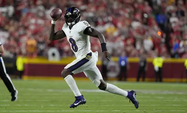 Baltimore Ravens quarterback Lamar Jackson runs with the ball during the second half of an NFL football game against the Kansas City Chiefs Thursday, Sept. 5, 2024, in Kansas City, Mo. (AP Photo/Ed Zurga)