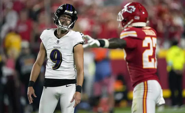 Kansas City Chiefs' Chamarri Conner, right, reacts to a missed field goal attempt by Baltimore Ravens kicker Justin Tucker (9) during the first half of an NFL football game Thursday, Sept. 5, 2024, in Kansas City, Mo. (AP Photo/Charlie Riedel)