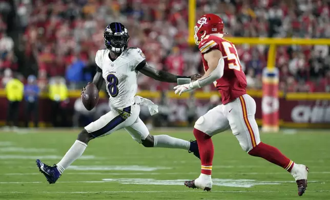 Baltimore Ravens quarterback Lamar Jackson (8) scrambles as Kansas City Chiefs linebacker Leo Chenal defends during the second half of an NFL football game Thursday, Sept. 5, 2024, in Kansas City, Mo. (AP Photo/Ed Zurga)