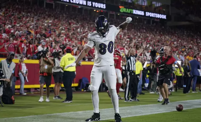 Baltimore Ravens tight end Isaiah Likely celebrates after scoring during the second half of an NFL football game against the Kansas City Chiefs Thursday, Sept. 5, 2024, in Kansas City, Mo. (AP Photo/Ed Zurga)