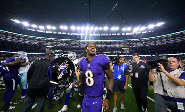 Baltimore Ravens quarterback Lamar Jackson (8) walks off the field after the team's NFL football game against the Dallas Cowboys in Arlington, Texas, Sunday, Sept. 22, 2024. (AP Photo/Julio Cortez)