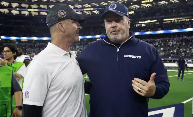 Baltimore Ravens head coach John Harbaugh, left, and Dallas Cowboys head coach Mike McCarthy, right, greet each other after the team's NFL football game in Arlington, Texas, Sunday, Sept. 22, 2024. (AP Photo/Gareth Patterson)