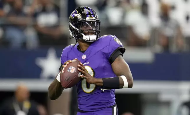 Baltimore Ravens quarterback Lamar Jackson warms up before an NFL football game against the Dallas Cowboys in Arlington, Texas, Sunday, Sept. 22, 2024. (AP Photo/Julio Cortez)