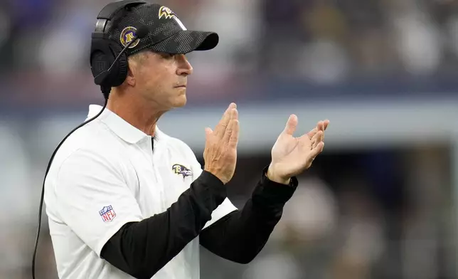 Baltimore Ravens head coach John Harbaugh watches play against the Dallas Cowboys in the second half of an NFL football game in Arlington, Texas, Sunday, Sept. 22, 2024. (AP Photo/Julio Cortez)