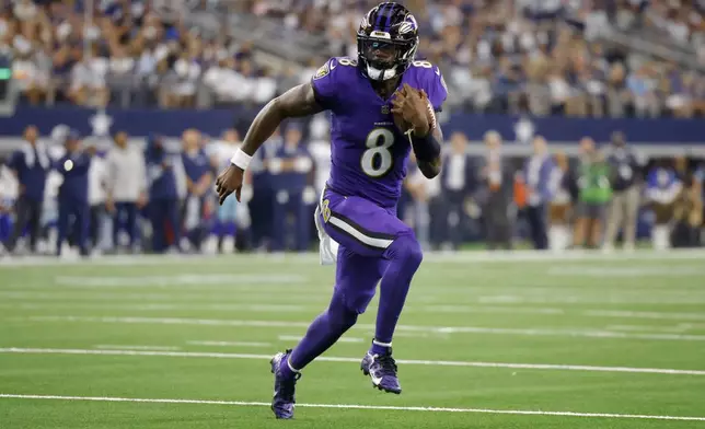 Baltimore Ravens quarterback Lamar Jackson sprints to the end zone to score a touchdown against the Dallas Cowboys in the first half of an NFL football game in Arlington, Texas, Sunday, Sept. 22, 2024. (AP Photo/Gareth Patterson)