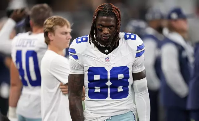 Dallas Cowboys wide receiver CeeDee Lamb walks on the team's sideline in the first half of an NFL football game against the Baltimore Ravens in Arlington, Texas, Sunday, Sept. 22, 2024. (AP Photo/Jeffrey McWhorter)