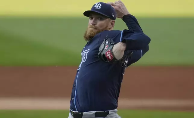 Tampa Bay Rays' Drew Rasmussen pitches in the first inning of a baseball game against the Cleveland Guardians, Saturday, Sept. 14, 2024, in Cleveland. (AP Photo/Sue Ogrocki)