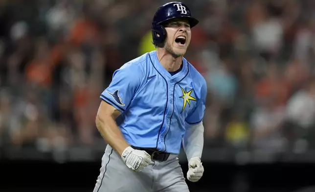 Tampa Bay Rays' Taylor Walls reacts after lining out during the sixth inning of a baseball game against the Baltimore Orioles, Friday, Sept. 6, 2024, in Baltimore. (AP Photo/Stephanie Scarbrough)