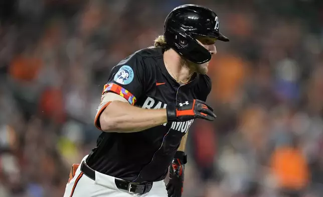 Baltimore Orioles' Gunnar Henderson advances toward first base after hitting a single during the fourth inning of a baseball game against the Tampa Bay Rays, Friday, Sept. 6, 2024, in Baltimore. (AP Photo/Stephanie Scarbrough)