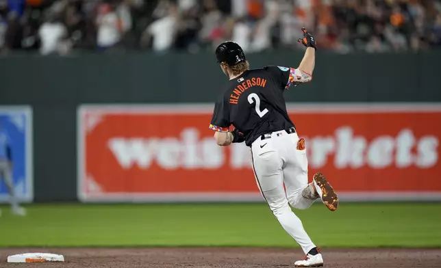 Baltimore Orioles' Gunnar Henderson rounds the bases after hitting a home run during the sixth inning of a baseball game against the Tampa Bay Rays, Friday, Sept. 6, 2024, in Baltimore. (AP Photo/Stephanie Scarbrough)